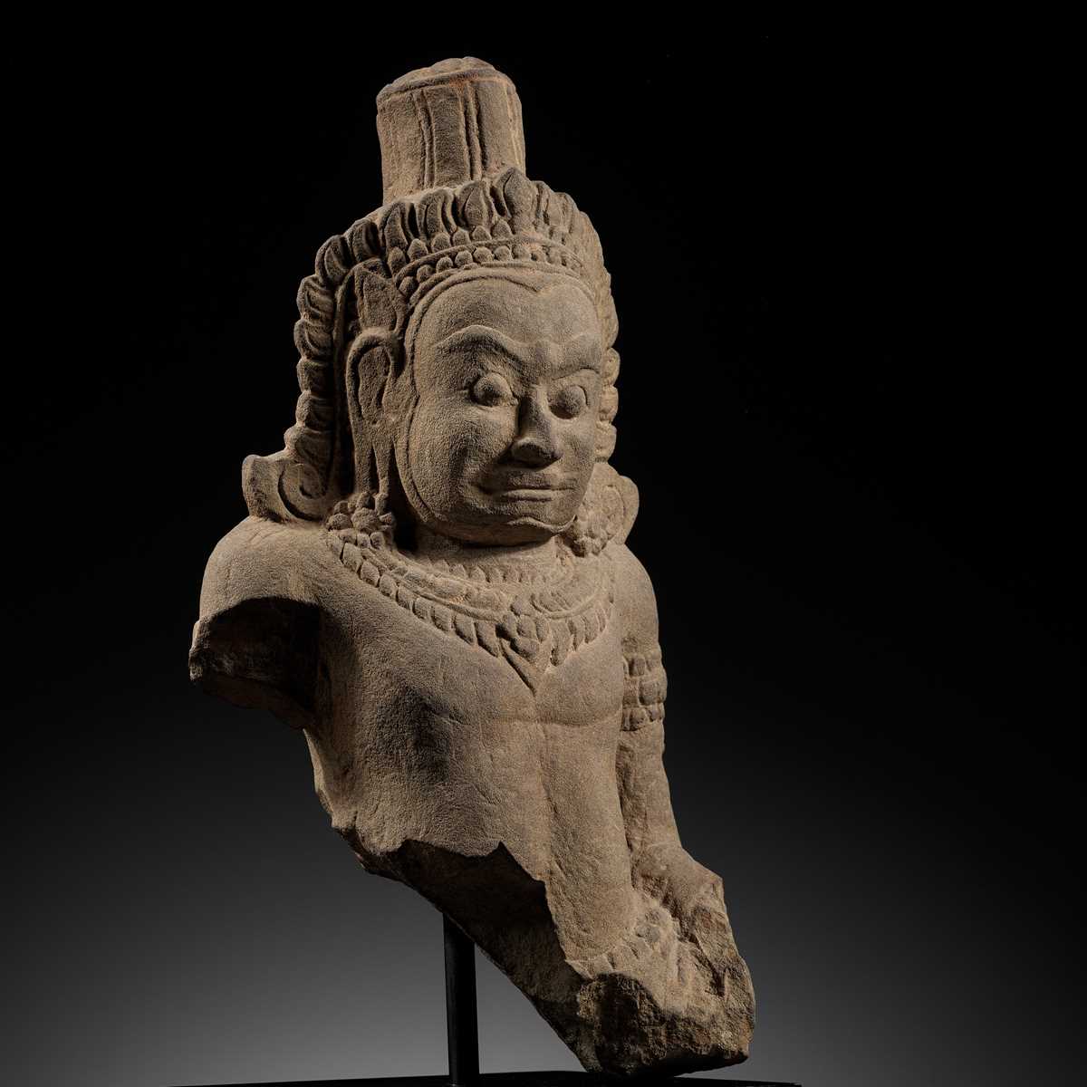 Lot 709 - A SANDSTONE BUST OF A DEMON, ASURA, ANGKOR PERIOD