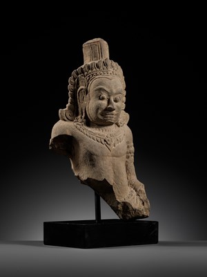 Lot 709 - A SANDSTONE BUST OF A DEMON, ASURA, ANGKOR PERIOD