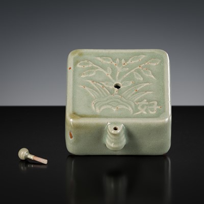 Lot 570 - A CELADON-GLAZED SQUARE WATER DROPPER AND MATCHING STOPPER, JOSEON DYNASTY