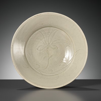 Lot 155 - A CARVED DINGYAO WHITE-GLAZED ‘LOTUS’ BOWL, SONG DYNASTY