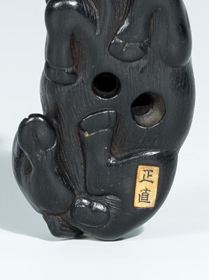 Lot 397 - A GOOD EBONY WOOD NETSUKE OF AN OX