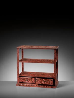 Lot 21 - A FINE CINNABAR LACQUER DISPLAY STAND, QING DYNASTY