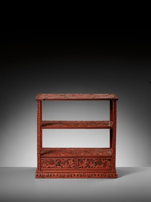 Lot 21 - A FINE CINNABAR LACQUER DISPLAY STAND, QING DYNASTY