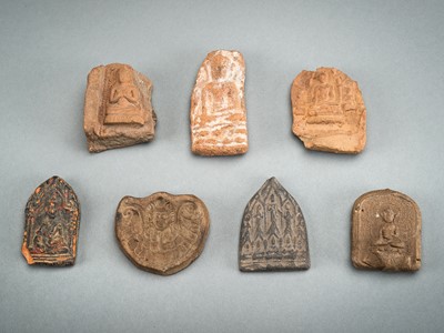 A GROUP OF SEVEN CLAY VOTIVE PLAQUES, 19th CENTURY