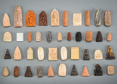 A LOT WITH 41 CLAY AND STONE VOTIVE PLAQUES, 19TH CENTURY