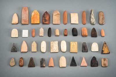 A LOT WITH 41 CLAY AND STONE VOTIVE PLAQUES, 19TH CENTURY