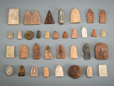 A LOT WITH 34 CLAY AND STONE VOTIVE PLAQUES, 19TH CENTURY