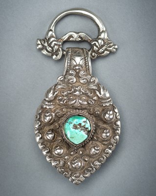 A TURQUOISE INSET SILVER ORNAMENT, 19th CENTURY