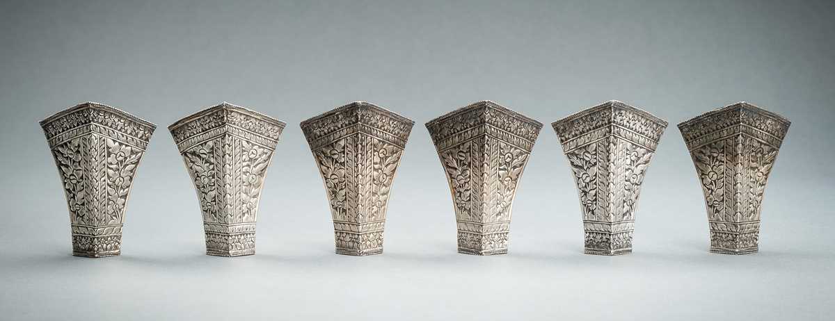 Lot 553 - A GROUP OF SIX EMBOSSED SILVER BETEL LEAF HOLDERS, c. 1900s