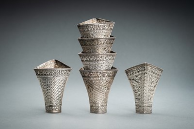 Lot 553 - A GROUP OF SIX EMBOSSED SILVER BETEL LEAF HOLDERS, c. 1900s