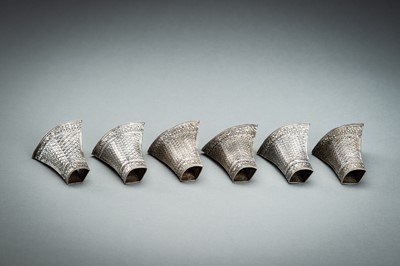 Lot 553 - A GROUP OF SIX EMBOSSED SILVER BETEL LEAF HOLDERS, c. 1900s