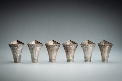 Lot 553 - A GROUP OF SIX EMBOSSED SILVER BETEL LEAF HOLDERS, c. 1900s