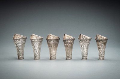 Lot 553 - A GROUP OF SIX EMBOSSED SILVER BETEL LEAF HOLDERS, c. 1900s