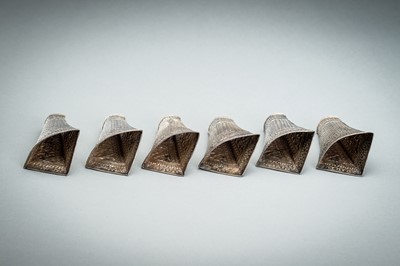 Lot 553 - A GROUP OF SIX EMBOSSED SILVER BETEL LEAF HOLDERS, c. 1900s
