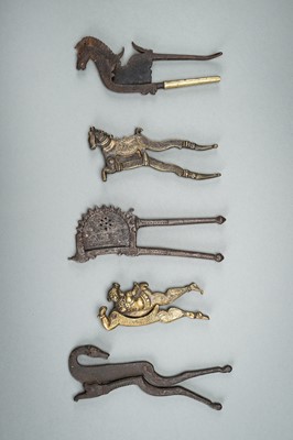 A GROUP OF FIVE BRONZE AND IRON BETEL NUT CUTTERS
