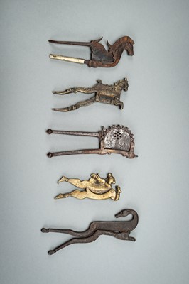 A GROUP OF FIVE BRONZE AND IRON BETEL NUT CUTTERS