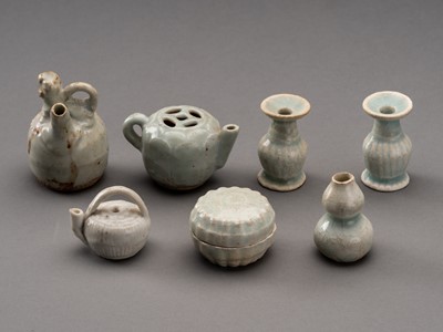 Lot 1229 - A SET OF SEVEN SMALL QINGBAI GLAZED CERAMIC VESSELS, SONG TO MING DYNASTY