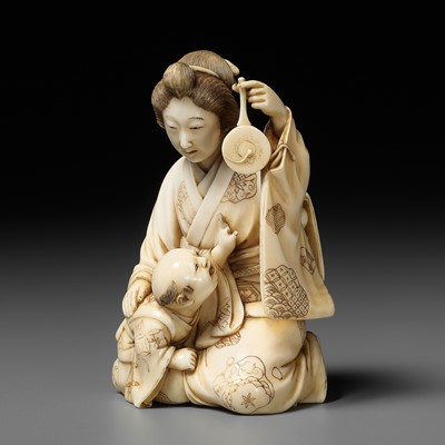 Lot 167 - TAIMIN: AN IVORY OKIMONO OF A MOTHER AND CHILD