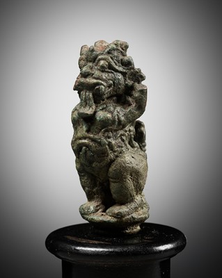 Lot 308 - A BRONZE BELL FINIAL IN THE FORM OF RAKSHASA, EASTERN JAVANESE PERIOD