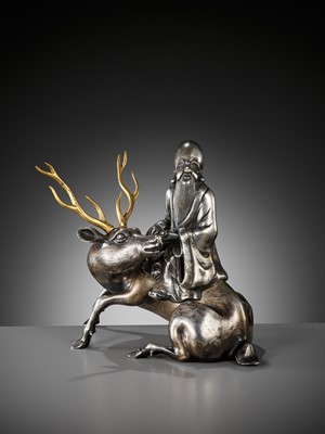 Lot 115 - A SILVERED AND GILT BRONZE ‘SHOULAO AND DEER’ INCENSE BURNER, QING DYNASTY