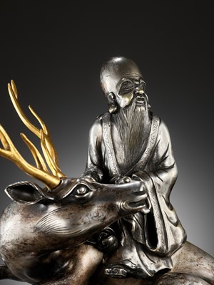 Lot 115 - A SILVERED AND GILT BRONZE ‘SHOULAO AND DEER’ INCENSE BURNER, QING DYNASTY