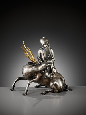 Lot 115 - A SILVERED AND GILT BRONZE ‘SHOULAO AND DEER’ INCENSE BURNER, QING DYNASTY