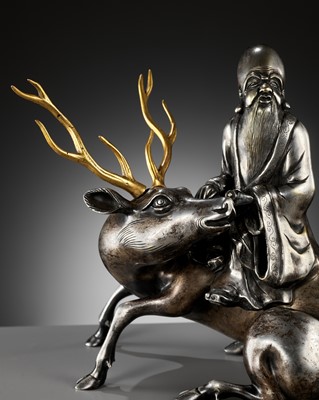 Lot 115 - A SILVERED AND GILT BRONZE ‘SHOULAO AND DEER’ INCENSE BURNER, QING DYNASTY