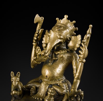 Lot 211 - A BRONZE FIGURE OF GANESHA, SOUTH INDIA, 17TH-18TH CENTURY