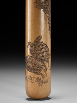 Lot 361 - IKKEI: A FINE PALE WOOD KISERUZUTSU DEPICTING A PAIR OF TURTLES BENEATH YOUNG PINE SPROUTS
