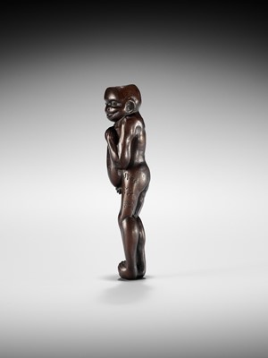 Lot 172 - MINKO: A TALL AND RARE WOOD NETSUKE OF A KAPPA FONDLING A CUCUMBER