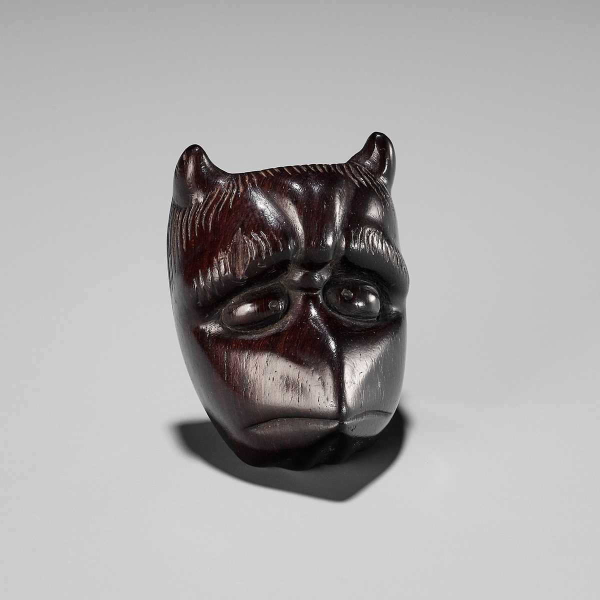 Lot 384 - YOSHIHISA: A VERY RARE WOOD MASK NETSUKE OF A HORNED KAPPA