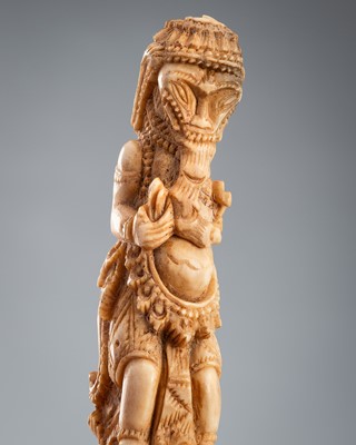 A CARVED BONE KRIS HILT IN THE FORM OF A YAKSHA, c. 1900s