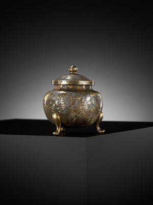 Lot 157 - A PARCEL-GILT SILVER TRIPOD JAR AND COVER, TANG DYNASTY