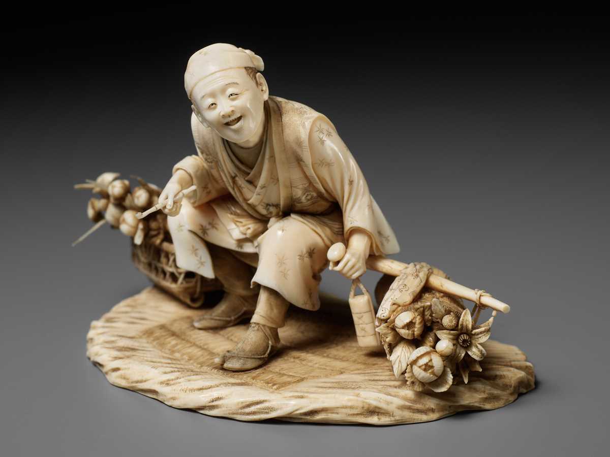 Lot 296 - TOSHIMUNE: A FINE IVORY OKIMONO DEPICTING A RESTING FLOWER SELLER