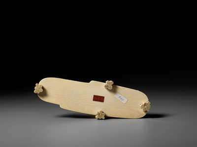 Lot 282 - SEISHU: A RARE IVORY OKIMONO OF A FISHERMAN REELING IN A FISH