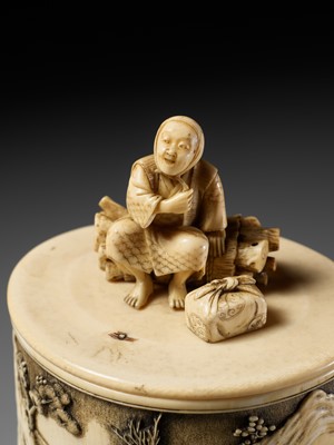 Lot 273 - YASUHARU: A FINE IVORY TUSK BOX AND COVER IN DEPICTING A BRUSHWOOD COLLECTOR