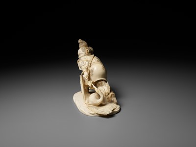 Lot 141 - KOGETSU: A FINE IVORY OKIMONO OF A HUNTER SNARING A CRANE