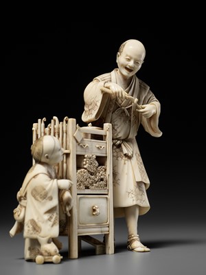Lot 285 - ICHIYOSAI SOKO: A RARE IVORY OKIMONO DEPICTING A KISERU (PIPE) MAKER WITH HIS SON
