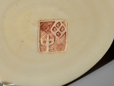 Lot 272 - TANAKA REIGYOKU: A FINE IVORY TUSK BOX AND COVER DEPICTING A SNAKE EATING A SPARROW