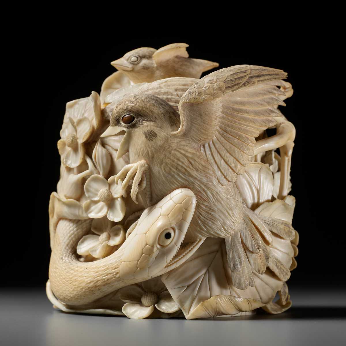 Lot 272 - TANAKA REIGYOKU: A FINE IVORY TUSK BOX AND COVER DEPICTING A SNAKE EATING A SPARROW