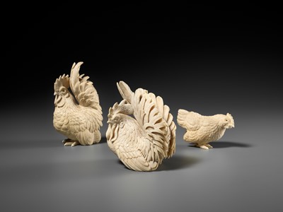 Lot 152 - A GROUP OF IVORY OKIMONO DEPICTING ROOSTERS WITH HEN