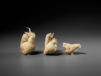 Lot 152 - A GROUP OF IVORY OKIMONO DEPICTING ROOSTERS WITH HEN