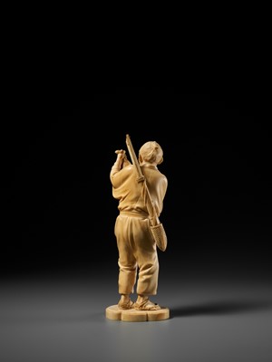 Lot 138 - KOSEI: A FINE TOKYO SCHOOL IVORY OKIMONO OF A HUNTER HOLDING A HARE