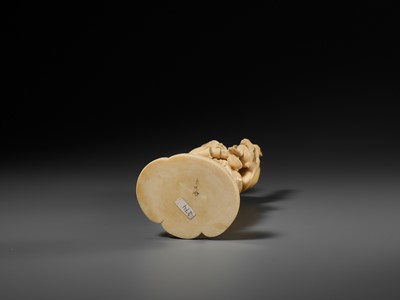 Lot 138 - KOSEI: A FINE TOKYO SCHOOL IVORY OKIMONO OF A HUNTER HOLDING A HARE