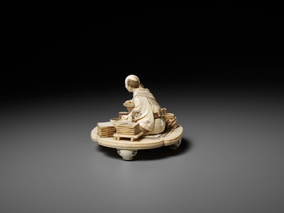 Lot 283 - SEISHI: A FINE AND RARE IVORY OKIMONO OF A WOODBLOCK PRINT MAKER WITH HIS SON
