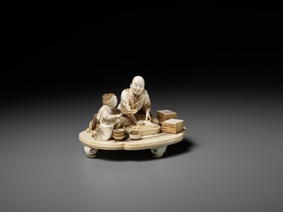 Lot 283 - SEISHI: A FINE AND RARE IVORY OKIMONO OF A WOODBLOCK PRINT MAKER WITH HIS SON