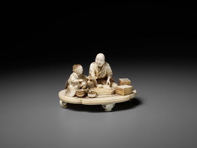 Lot 283 - SEISHI: A FINE AND RARE IVORY OKIMONO OF A WOODBLOCK PRINT MAKER WITH HIS SON