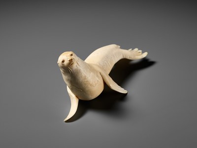 Lot 149 - ITASAKA KASON: A VERY RARE IVORY OKIMONO DEPICTING A RECUMBENT SEA LION