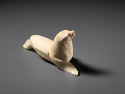 Lot 149 - ITASAKA KASON: A VERY RARE IVORY OKIMONO DEPICTING A RECUMBENT SEA LION