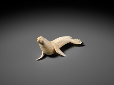 Lot 149 - ITASAKA KASON: A VERY RARE IVORY OKIMONO DEPICTING A RECUMBENT SEA LION
